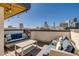 Rooftop deck with outdoor furniture and cityscape views at 2426 Welton St, Denver, CO 80205