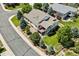 Beautiful home with well-maintained lawn, mature trees, and a charming fenced yard, showcasing curb appeal at 5309 Mining Camp Trl, Parker, CO 80134