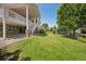 Large, well-manicured backyard with mature trees and a wooden fence at 5309 Mining Camp Trl, Parker, CO 80134