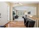 Welcoming foyer with hardwood floors, a modern light fixture, and an open view into the living room at 5309 Mining Camp Trl, Parker, CO 80134
