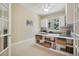 Office space with window views, vaulted ceiling, desk, and built-in shelving at 5309 Mining Camp Trl, Parker, CO 80134