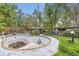 The in-ground pool, featuring a diving board, is a central feature of the verdant backyard at 2220 Lee St, Lakewood, CO 80215