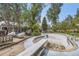 The expansive backyard features an in-ground pool and a sunroom attached to the house at 2220 Lee St, Lakewood, CO 80215