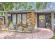 Charming front porch with seating, perfect for relaxing and enjoying the outdoor scenery at 2220 Lee St, Lakewood, CO 80215