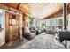 Spacious living room with plush seating, a wood burning stove, and plenty of natural light at 2220 Lee St, Lakewood, CO 80215