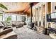 Cozy living room featuring a wood-burning stove and comfortable seating arrangements at 2220 Lee St, Lakewood, CO 80215