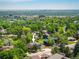 Home in a vibrant area with distant city views nestled in greenery at 14023 W Alaska Dr, Lakewood, CO 80228