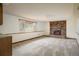 Basement living area with a fireplace and carpet flooring at 14023 W Alaska Dr, Lakewood, CO 80228