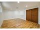 Basement area with wood-look floors, recessed lighting, and a large closet at 14023 W Alaska Dr, Lakewood, CO 80228