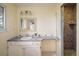 Well-maintained bathroom features a shower with tile surround, a sink with vanity, and good light at 14023 W Alaska Dr, Lakewood, CO 80228