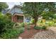 Beautifully landscaped front yard with vibrant flowers and lush greenery at 14023 W Alaska Dr, Lakewood, CO 80228