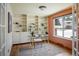 Bright home office with custom built-in shelves, hardwood floors, and a large window at 14023 W Alaska Dr, Lakewood, CO 80228