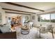Cozy living room offering access to an open kitchen and ample light at 14023 W Alaska Dr, Lakewood, CO 80228