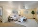 Spacious main bedroom features a ceiling fan, a large window, and room for furnishings at 14023 W Alaska Dr, Lakewood, CO 80228