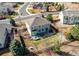 Expansive aerial view of a home featuring a large backyard with patio, landscaping, and privacy fence at 16590 Hitching Post Cir, Parker, CO 80134