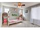 bedroom with ceiling fan, natural light, and princess theme at 16590 Hitching Post Cir, Parker, CO 80134