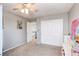 Neutral toned bedroom with standard closet, ceiling fan, and direct access to hallway and other rooms at 16590 Hitching Post Cir, Parker, CO 80134