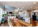 Open-concept space showing dining area, fireplace and kitchen island at 16590 Hitching Post Cir, Parker, CO 80134
