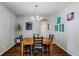 Dining room featuring a chandelier and hardwood floors at 16590 Hitching Post Cir, Parker, CO 80134