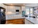 Modern kitchen with white cabinets, stainless steel appliances, granite countertops, and a subway tile backsplash at 16590 Hitching Post Cir, Parker, CO 80134