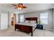 Inviting main bedroom with a ceiling fan, natural light and ensuite bathroom at 16590 Hitching Post Cir, Parker, CO 80134