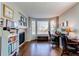 Home office with fireplace, built-in shelving, and a bay window at 16590 Hitching Post Cir, Parker, CO 80134