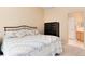 Comfortable bedroom featuring plush carpet, a double bed, and closet doors at 1374 Spotted Owl Way, Highlands Ranch, CO 80129