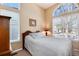 Comfortable bedroom featuring natural light, neutral color scheme, and plush carpet at 1374 Spotted Owl Way, Highlands Ranch, CO 80129