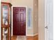 Entryway featuring wood floors, neutral walls, and a decorative cabinet at 1374 Spotted Owl Way, Highlands Ranch, CO 80129