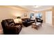 Inviting living room with leather seating and comfortable layout at 1374 Spotted Owl Way, Highlands Ranch, CO 80129