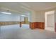 Finished basement area featuring wood-paneling, carpet, and recessed lighting at 13901 E Oxford Pl, Aurora, CO 80014