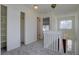 Bright hallway with carpet, access to bedrooms, and stairs leading to the lower level at 13901 E Oxford Pl, Aurora, CO 80014