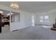 A view of the living room with an open design, that looks into the kitchen featuring a breakfast bar area at 13901 E Oxford Pl, Aurora, CO 80014