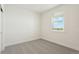 Simple bedroom with neutral carpeting and a window with a view at 42974 Colonial Trl, Elizabeth, CO 80107