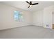 Spacious bedroom with neutral carpeting and large window at 42974 Colonial Trl, Elizabeth, CO 80107