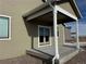 Covered patio with double doors and concrete flooring at 42974 Colonial Trl, Elizabeth, CO 80107