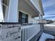 Charming front porch with stone and white railing at 42974 Colonial Trl, Elizabeth, CO 80107