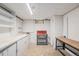 Unfinished basement with lots of room for storage and a work bench with lighting at 260 Flint Way, Broomfield, CO 80020