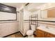 Vintage bathroom featuring a shower, vanity, and unique tilework at 260 Flint Way, Broomfield, CO 80020