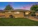 Charming single-story brick home featuring a well-manicured lawn and a cozy front porch at 260 Flint Way, Broomfield, CO 80020