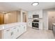 Stylish kitchen with white cabinets, stainless steel appliances, and an island at 260 Flint Way, Broomfield, CO 80020