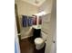 The bathroom features a toilet, vanity with shelves, towels and lights at 6585 W 84Th Way # 109, Arvada, CO 80003