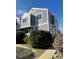 View of townhouse with gray siding, white trim, and a walkway leading to the entrance at 6585 W 84Th Way # 109, Arvada, CO 80003