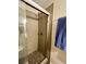 Modern shower with tiled walls, glass door and tiled floors at 6585 W 84Th Way # 109, Arvada, CO 80003