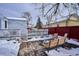 Deck and patio area in backyard with fire pit and seating at 3311 S Logan St, Englewood, CO 80113