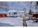 House backyard view with deck and snow covered ground at 3311 S Logan St, Englewood, CO 80113