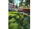 Spacious backyard with deck, grass, and flowers at 3311 S Logan St, Englewood, CO 80113