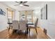 Elegant dining room with hardwood floors and a table set for six at 3311 S Logan St, Englewood, CO 80113