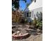 Landscaped front yard with colorful flowers and gravel at 3311 S Logan St, Englewood, CO 80113