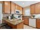 Updated kitchen with granite countertops and wood cabinets at 3311 S Logan St, Englewood, CO 80113